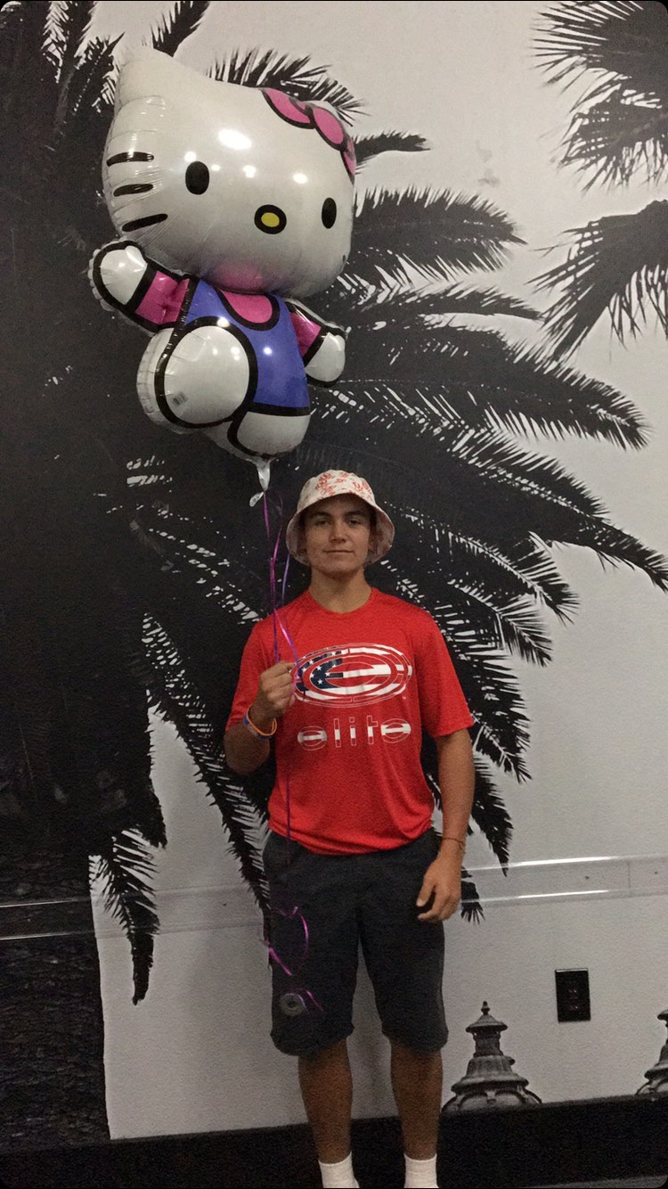 Person with Hello Kitty balloon